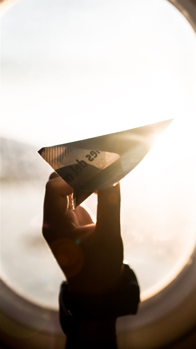 1284x2778 person holding paper plane - paper iPhone Wallpaper