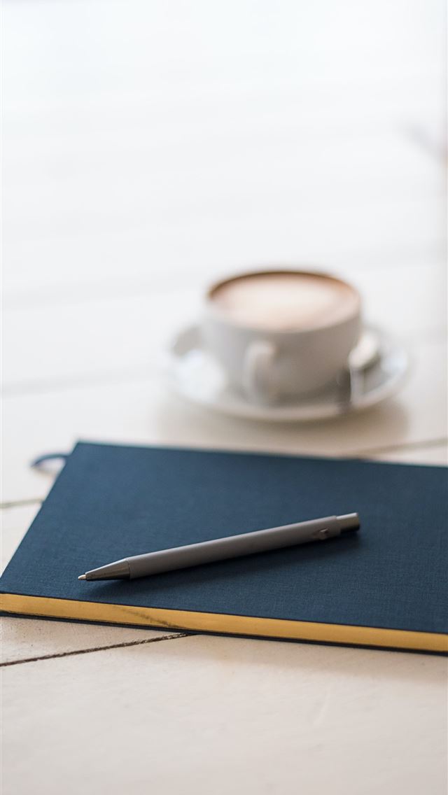 1284x2778 selective focus photography of black pen on book - coffee iPhone Wallpaper