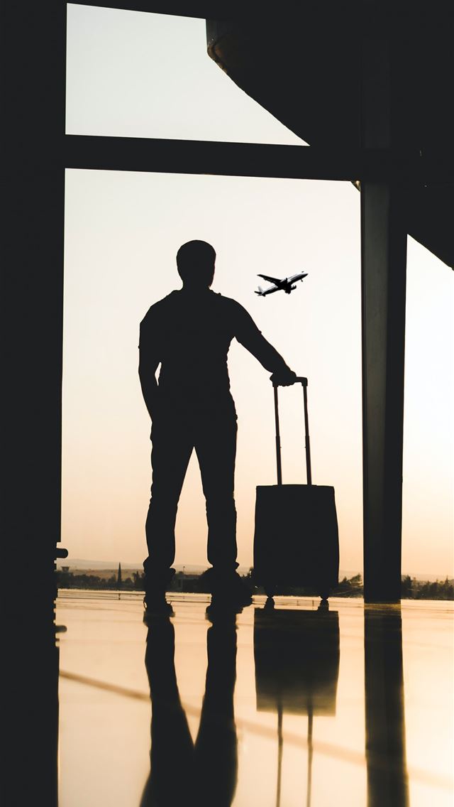 640x1136 silhouette of man holding luggage inside airport -  iPhone Wallpaper