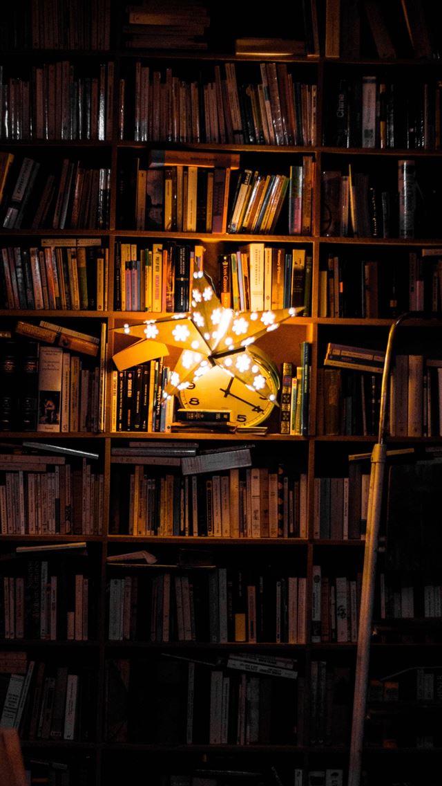1284x2778 photography of bookshelf and star LED light decor - lights iPhone Wallpaper