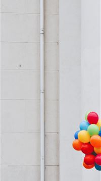 woman holding balloons wallpaper