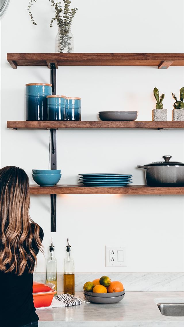 1284x2778 woman standing in front of kitchen sink - bright iPhone Wallpaper