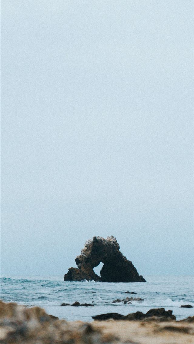 1284x2778 selective focus photography of rock monolith at th... - wave iPhone Wallpaper