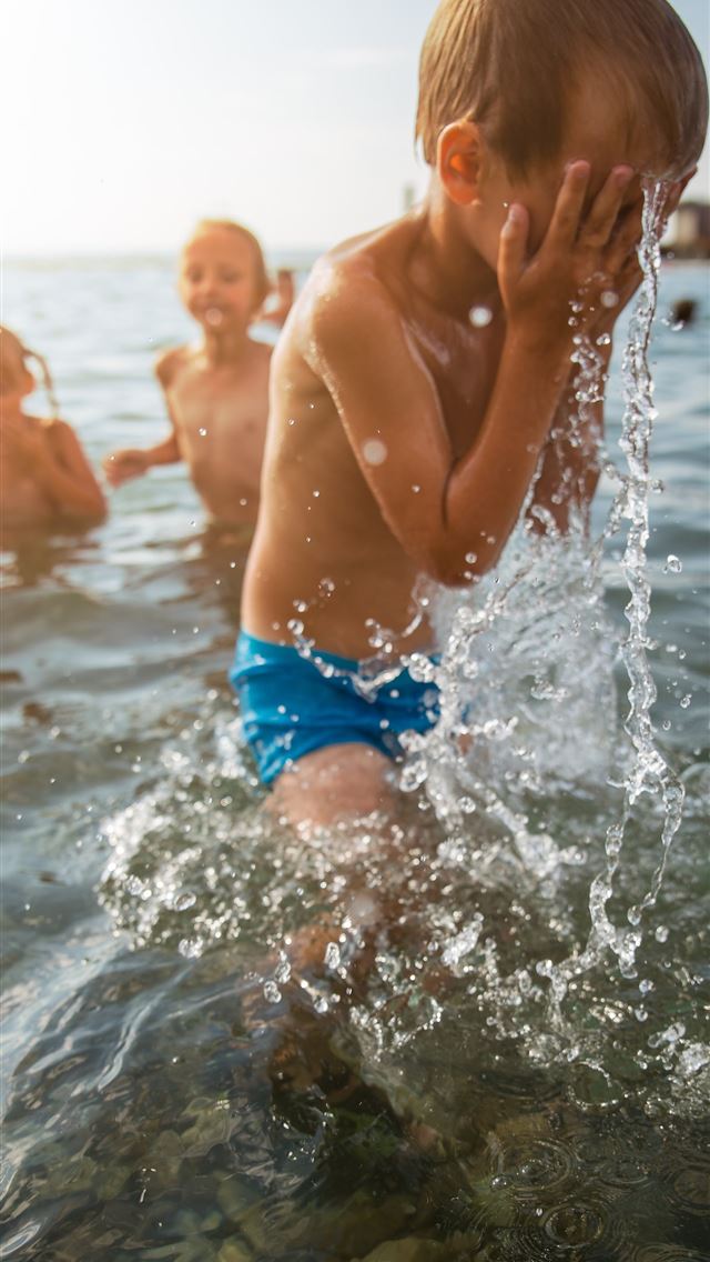 1284x2778 toddler pouring a water on his face - slovenia iPhone Wallpaper