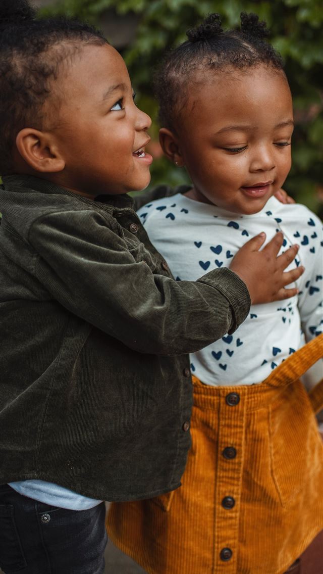 1284x2778 boy and girl surrounded by plants - love iPhone Wallpaper