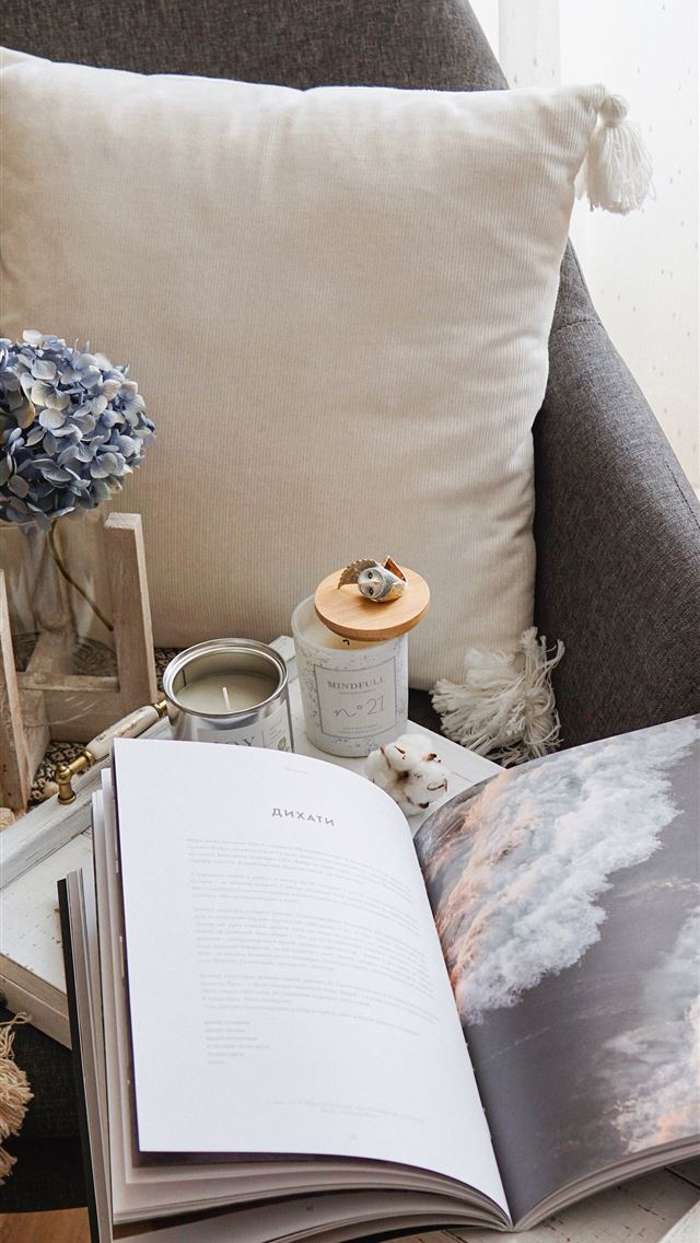 1284x2778 open book beside throw pillow - book iPhone Wallpaper