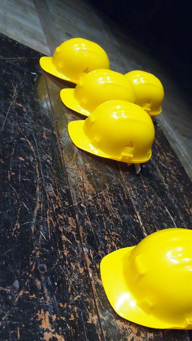 1284x2778 five yellow hard hats on gray surface -  iphone 13 Wallpaper