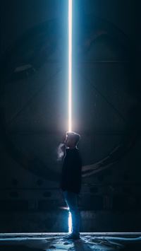 man in black jacket standing in tunnel wallpaper