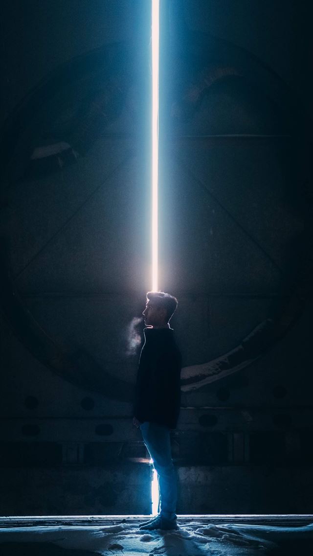 1284x2778 man in black jacket standing in tunnel - usa iPhone Wallpaper