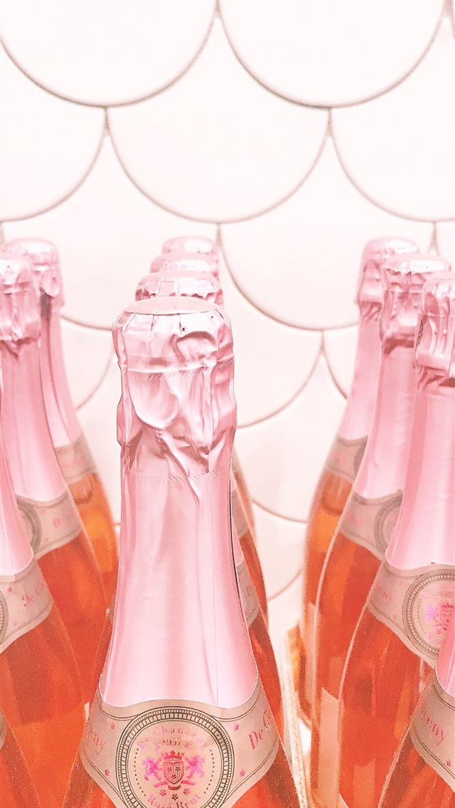 1284x2778 pink glass bottles on brown wooden table - pink iPhone Wallpaper