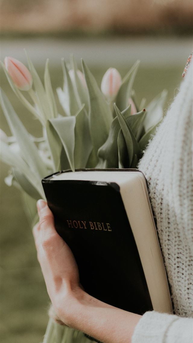 1284x2778 woman holding Holy Bible - quotes iPhone Wallpaper