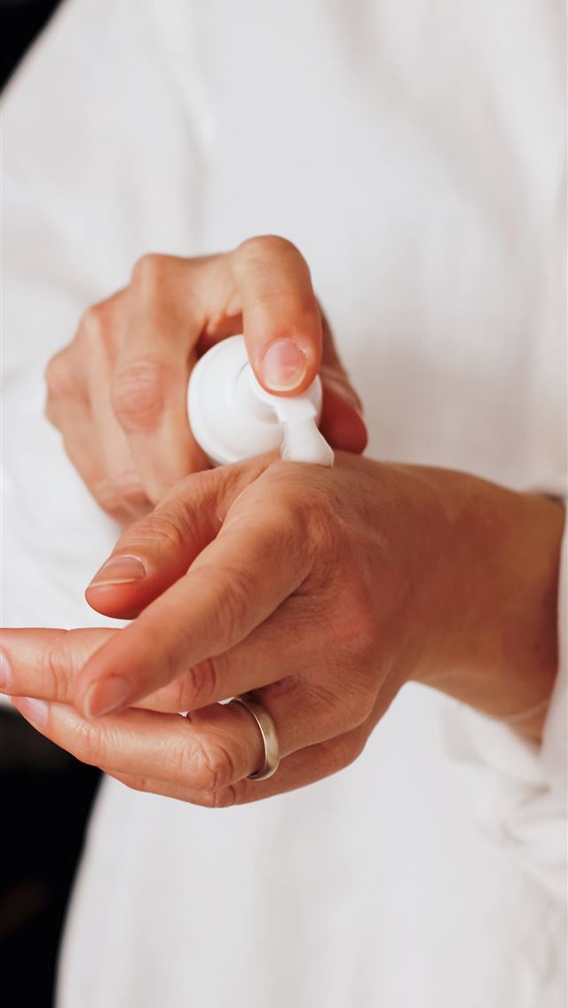 1284x2778 person holding white round ornament - italia iPhone Wallpaper
