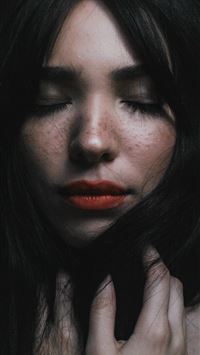 woman touching her hair wallpaper