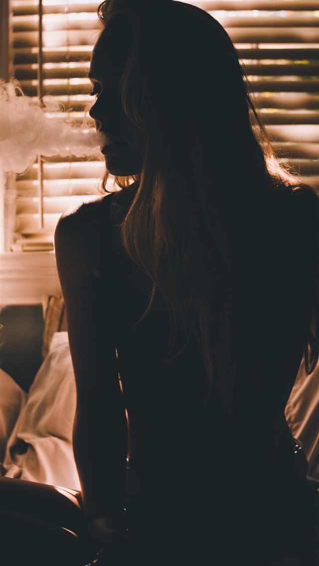 1284x2778 woman sitting on bed - smoke iPhone Wallpaper