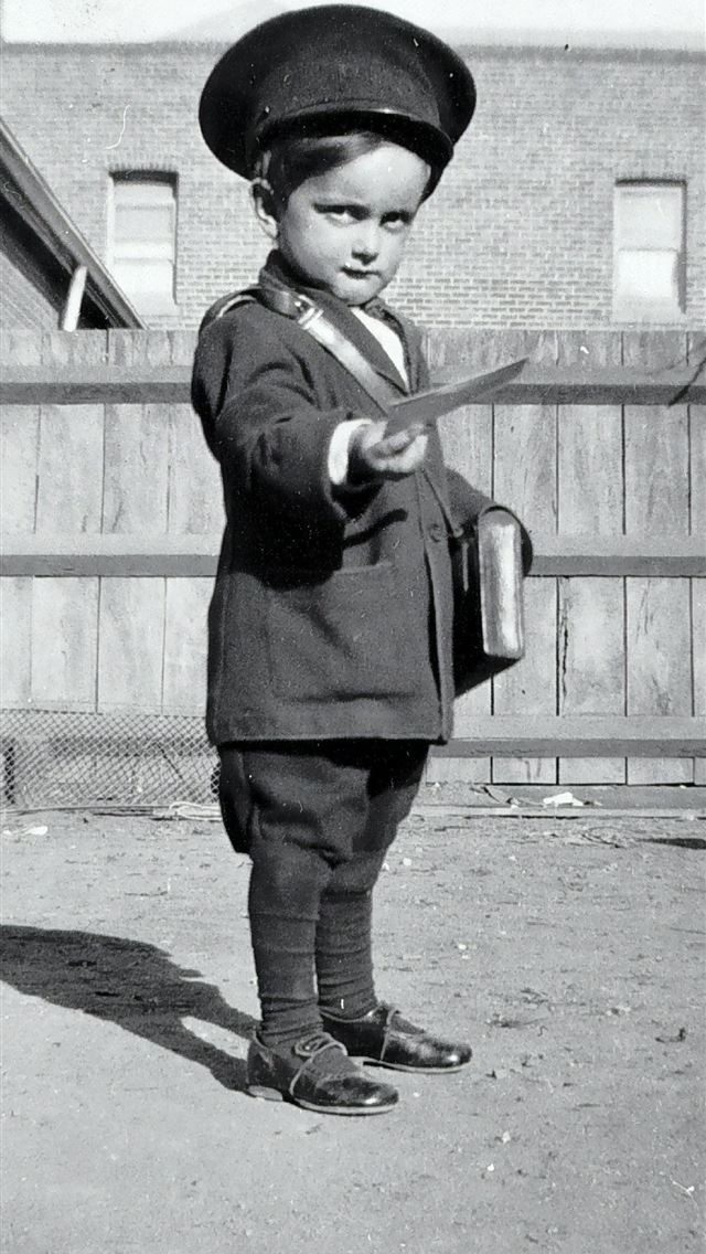 1284x2778 boy in black long sleeve shirt holding a stick - vintage iPhone Wallpaper