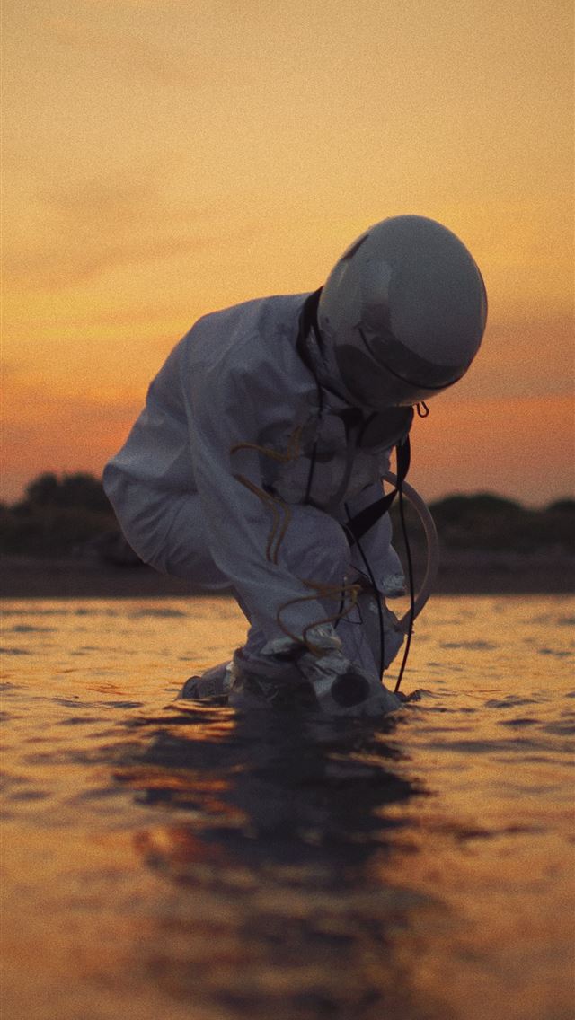 1284x2778 man in white dress shirt and black pants fishing o... - space iPhone Wallpaper