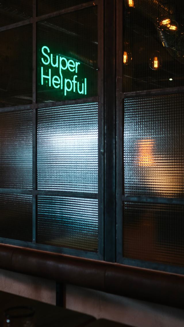 1125x2436 green Super helpful neon signage near window - gothenburg iPhone Wallpaper