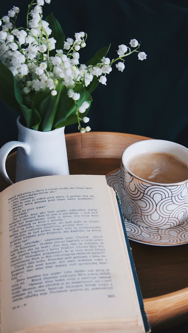 1290x2796 white and blue ceramic mug on brown wooden table - book iPhone Wallpaper