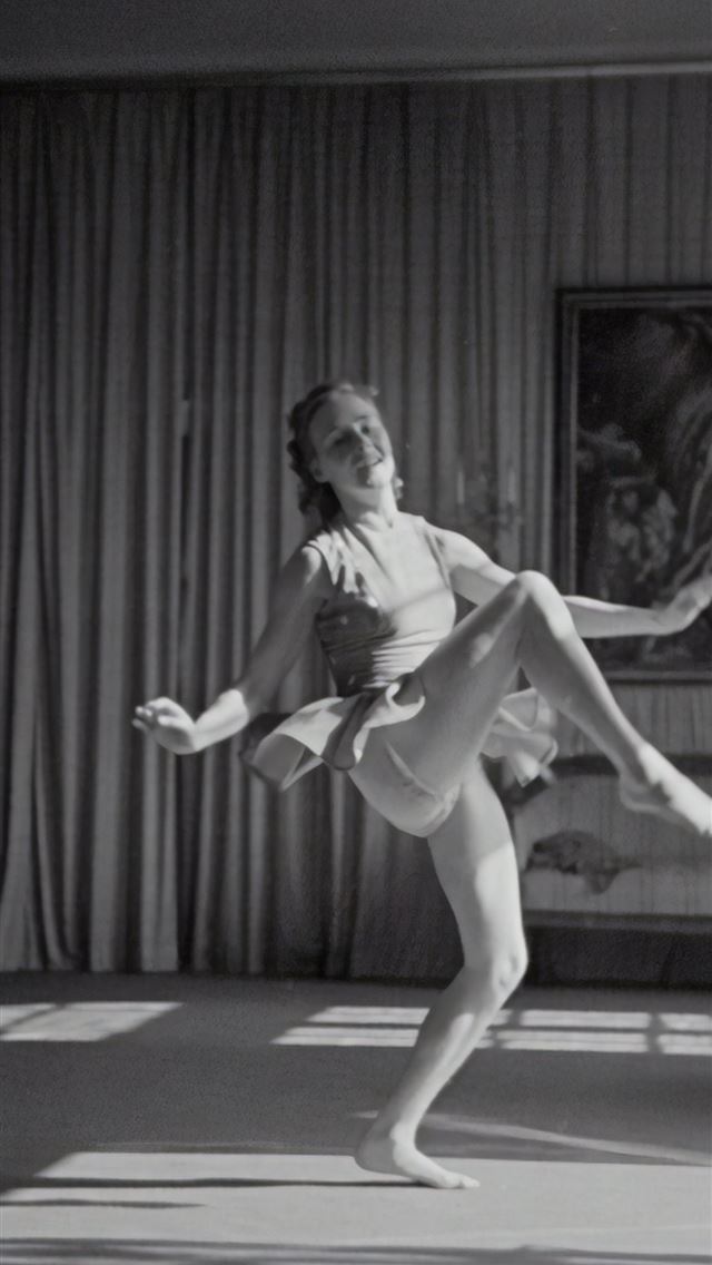 1290x2796 grayscale photo of woman dancing near curtain - vintage iPhone Wallpaper
