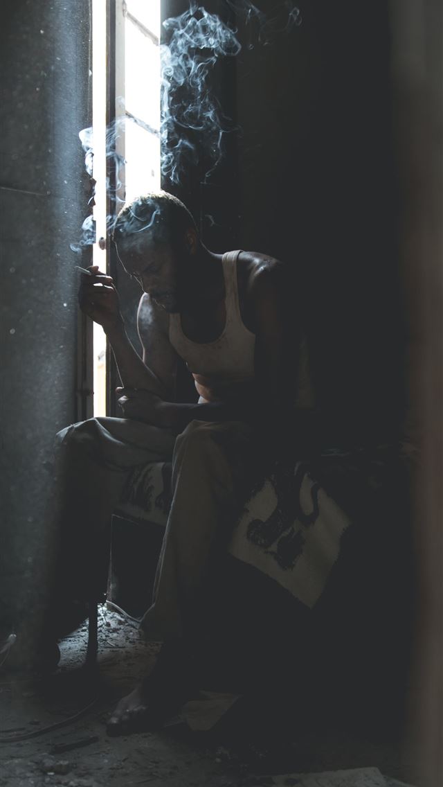 1290x2796 man smoking sitting on chair -  iPhone Wallpaper