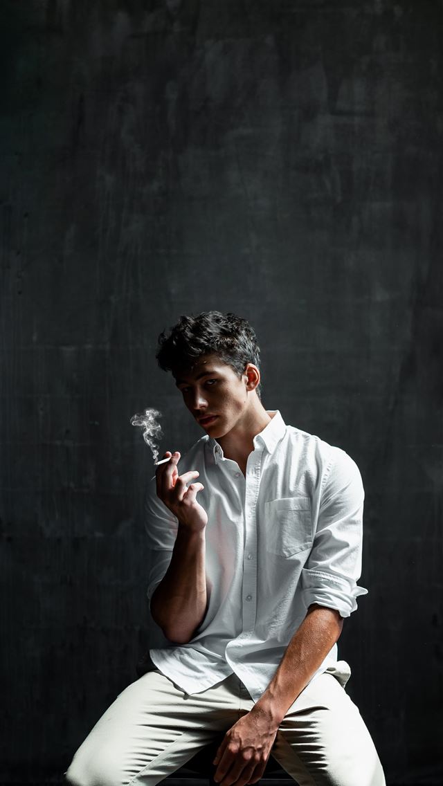 1290x2796 man sitting on chair smoking cigar - smoke iPhone Wallpaper