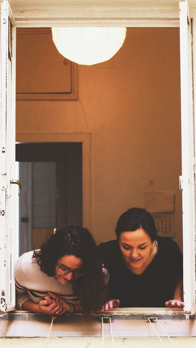 1290x2796 two woman looking through window - girls iPhone Wallpaper