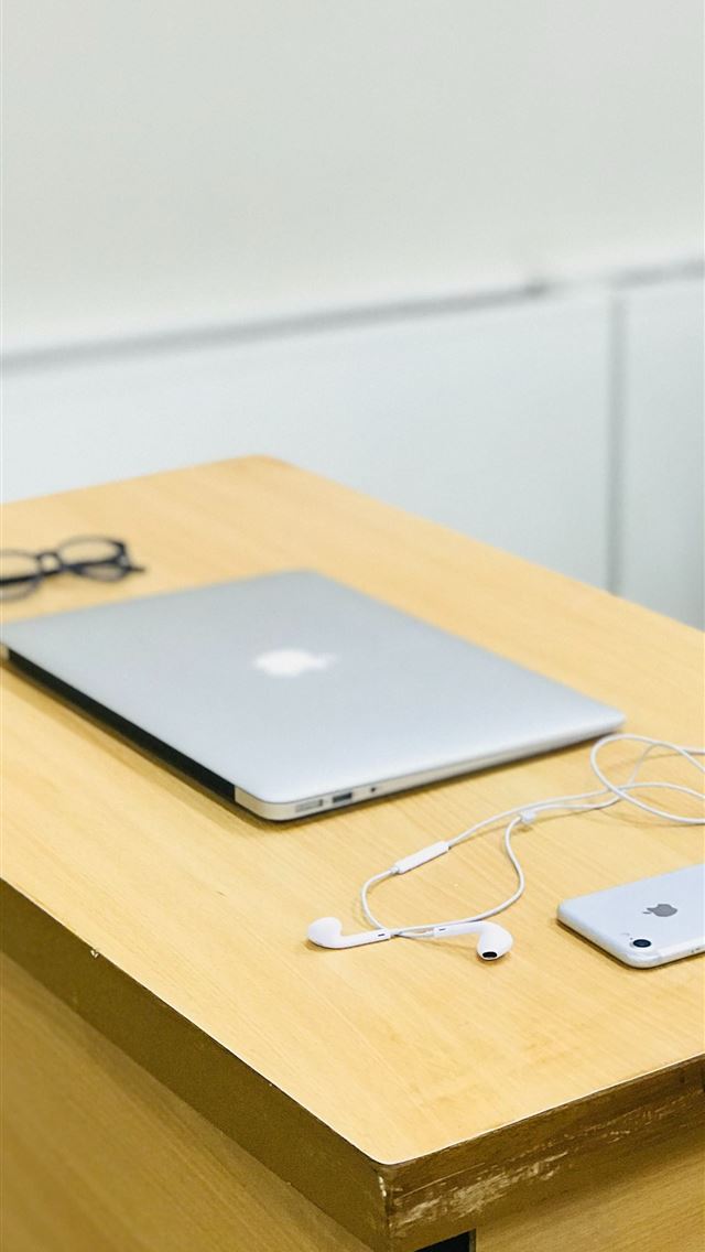 1290x2796 silver MacBook beside eyeglasses and iPhone - bright iPhone Wallpaper