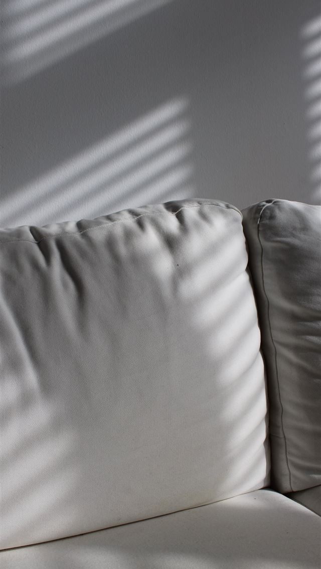 1290x2796 white leather sofa near white wall -  iphone 14 Wallpaper