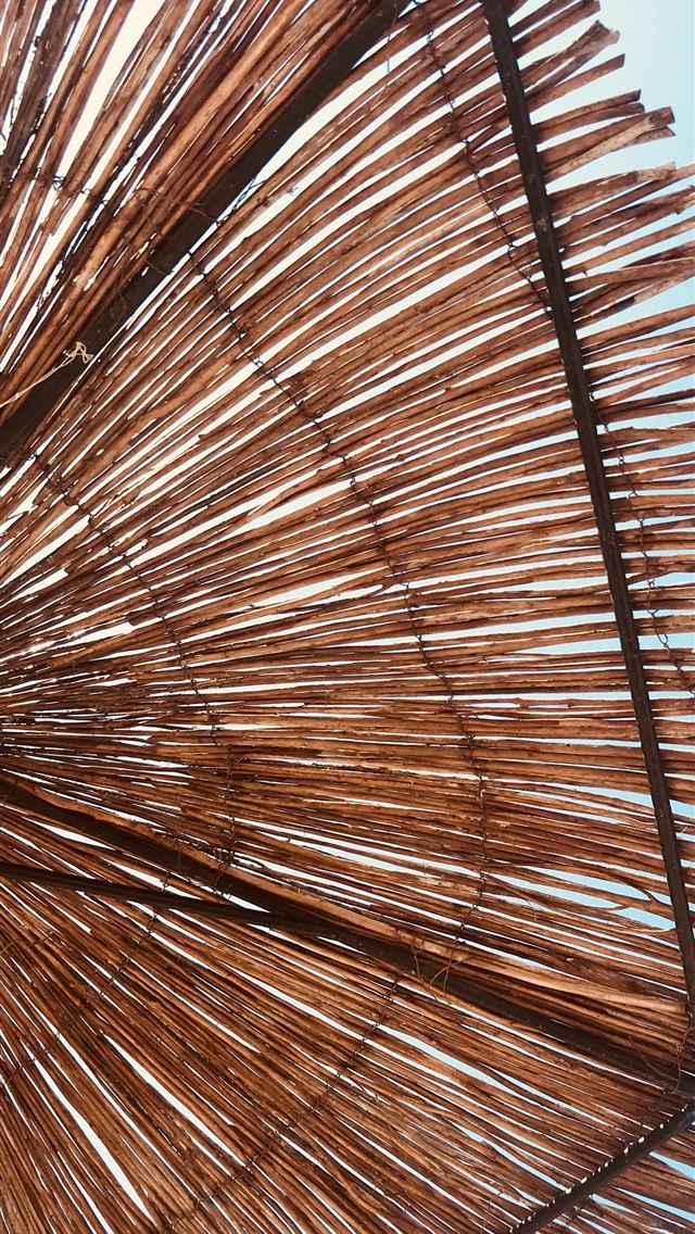 1290x2796 brown hay umbrella under blue sky -  iphone 14 Wallpaper