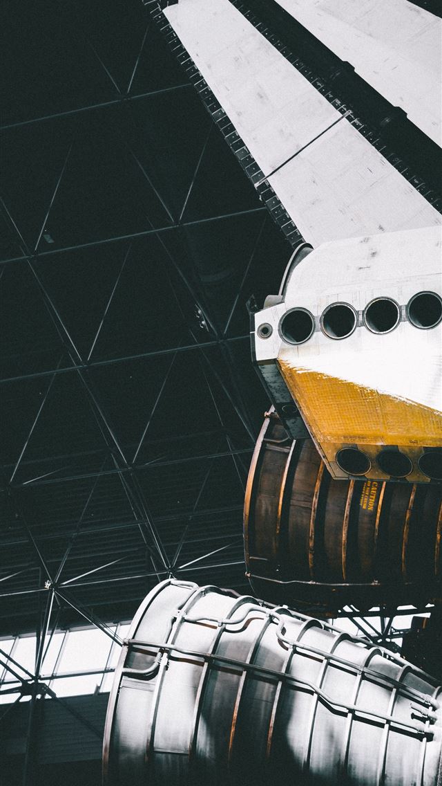 1290x2796 photo of white rocket ship inside warehouse - space iPhone Wallpaper