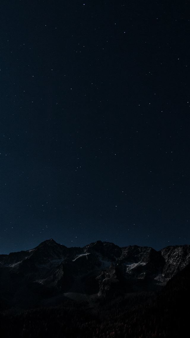 1290x2796 gray and brown mountains under starry night photo -  iphone 14 Wallpaper