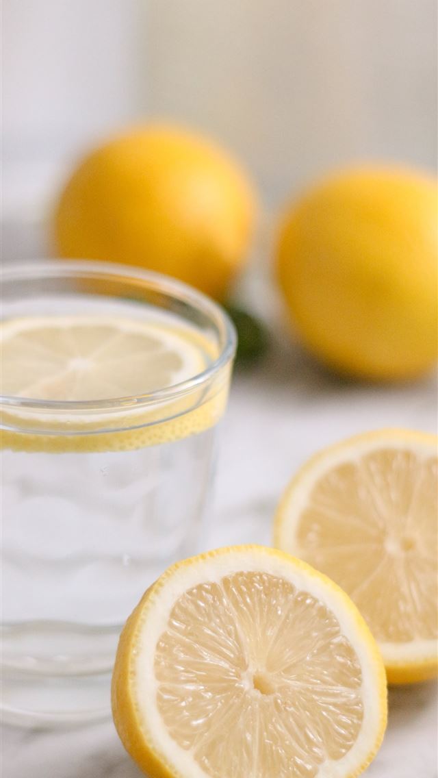 1290x2796 slice lemon beside cup -  iphone 14 Wallpaper