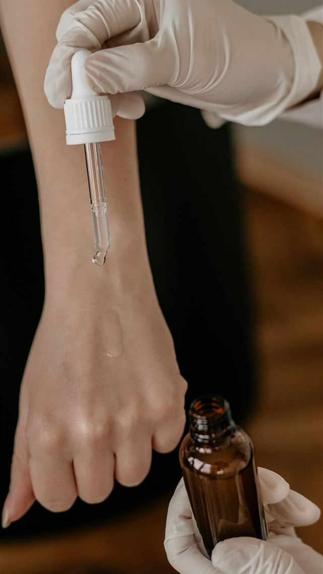 1290x2796 person with white gloves holding drop bottle point... -  iphone 14 Wallpaper
