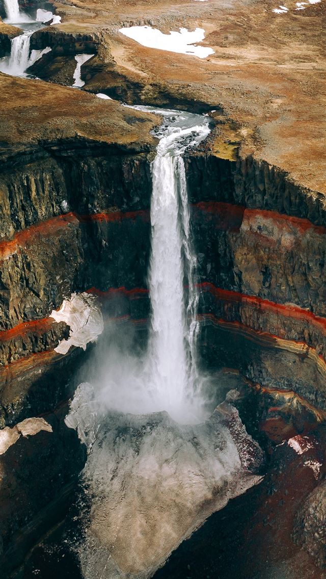 1290x2796 water falls on brown rocky mountain during daytime - spring iPhone Wallpaper