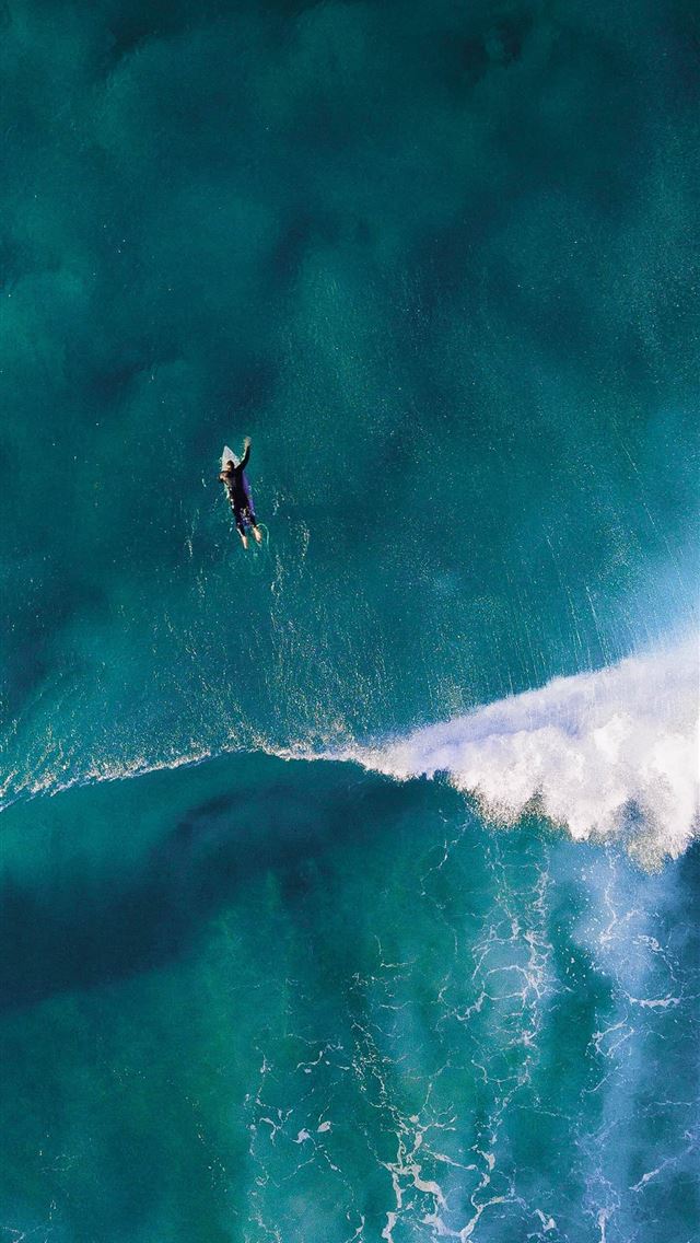 1290x2796 high angle photography of man surfing giant wave - teal iPhone Wallpaper