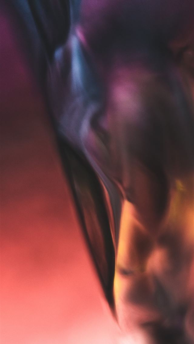 1290x2796 a blurry photo of a person with a cell phone - person iPhone Wallpaper