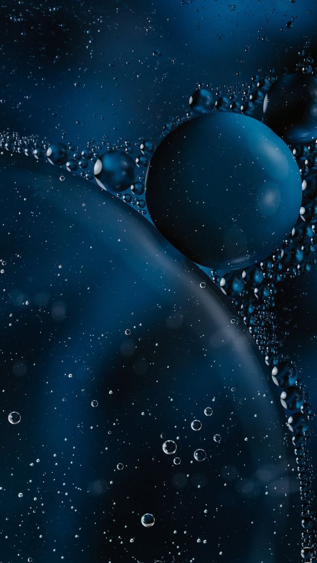 1290x2796 a close up of water bubbles on a black background -  iphone 14 Wallpaper