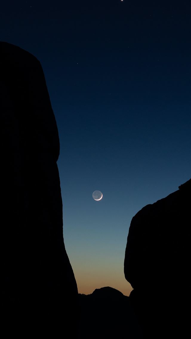 640x1136 the moon is setting over the mountains in the sky -  iPhone Wallpaper
