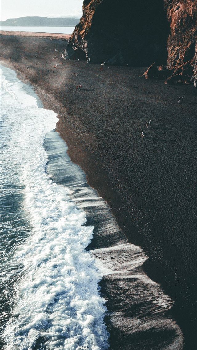1290x2796 a black beach with waves coming in to the shore - ocean iPhone Wallpaper
