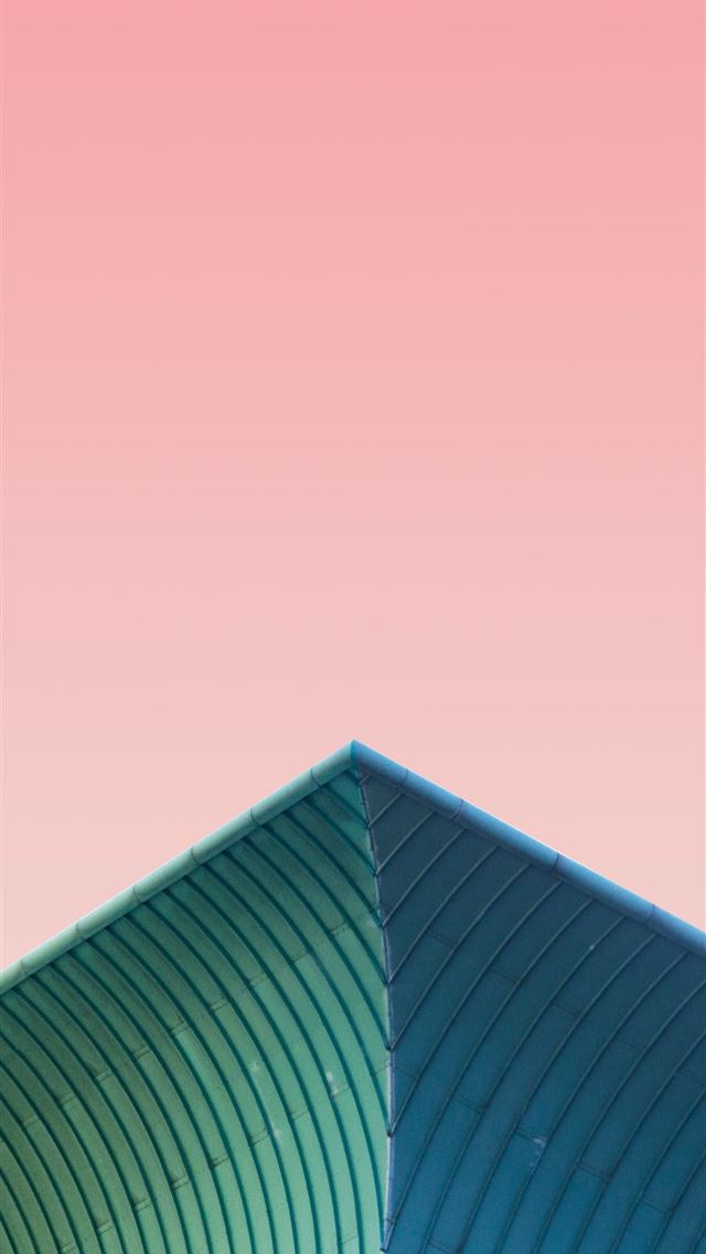 1290x2796 a plane flying over a building with a pink sky in ... - pink iPhone Wallpaper