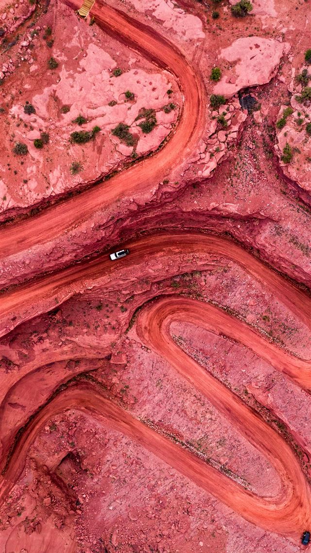 1290x2796 an aerial view of a winding road in the desert - landscape iPhone Wallpaper