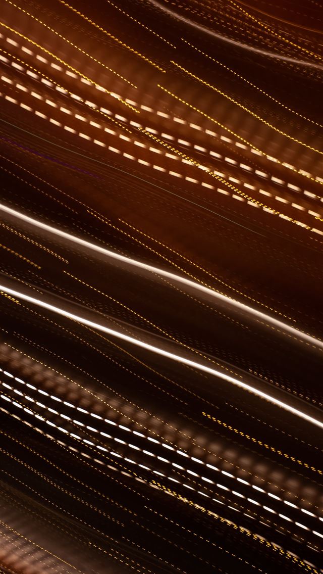 640x1136 a blurry photo of a street light at night -  iPhone Wallpaper
