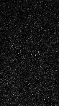 a black background with small bubbles of water wallpaper