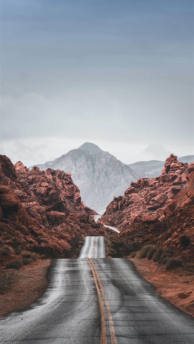 1290x2796 an empty road with a mountain in the background - road iPhone Wallpaper