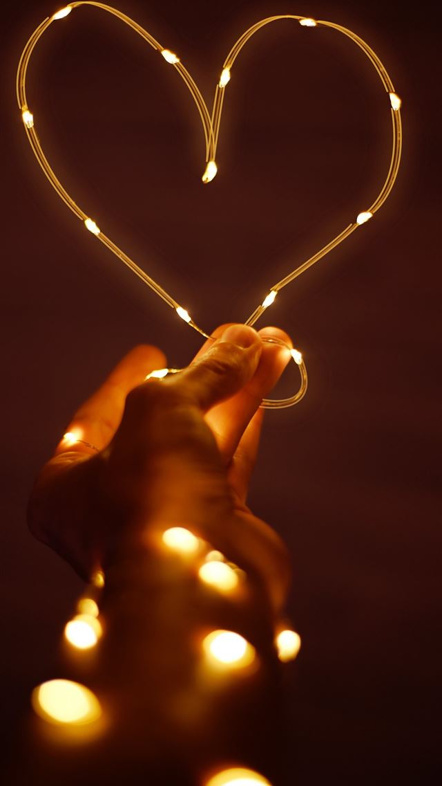 1290x2796 orange string light - heart iPhone Wallpaper