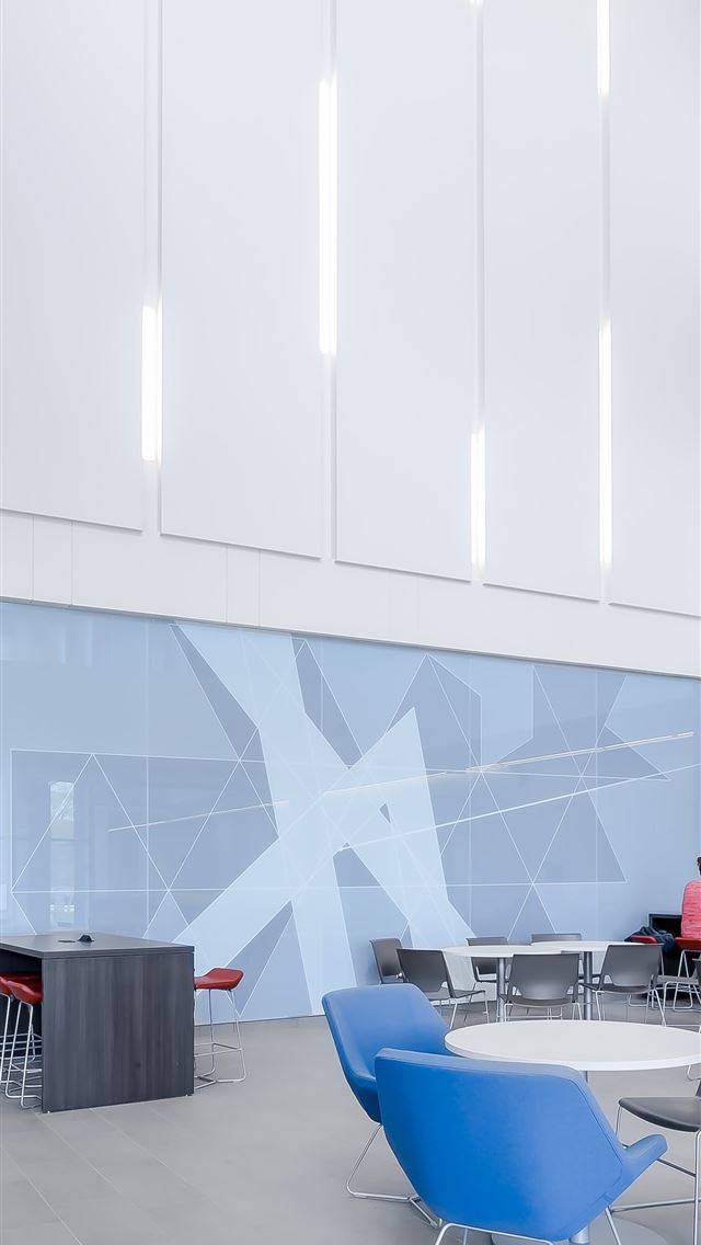 1290x2796 man standing beside wall and table  - bright iPhone Wallpaper