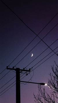 black electric post under blue sky during night ti... wallpaper