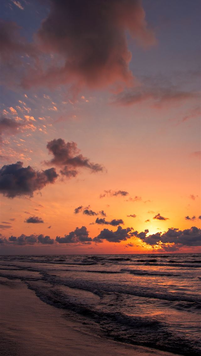 1290x2796 the sun is setting over the ocean on the beach -  iphone 14 Wallpaper
