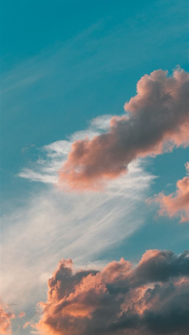 1242x2688 a plane flying in the sky with a lot of clouds - sky iPhone Wallpaper