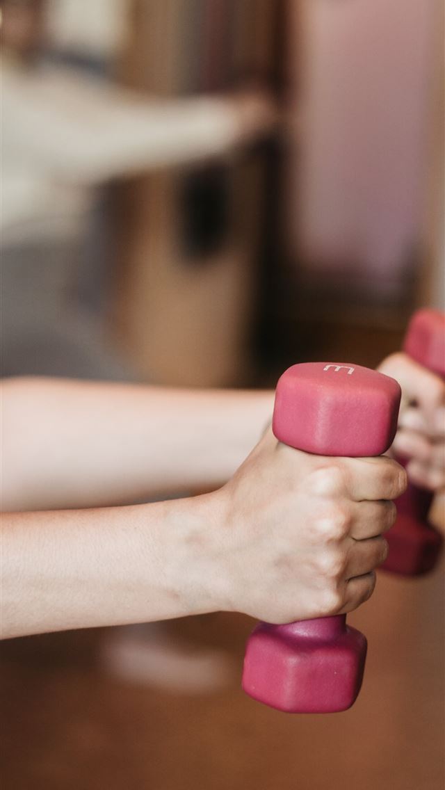 1290x2796 person holding pink and white dumbbells - quotes iPhone Wallpaper